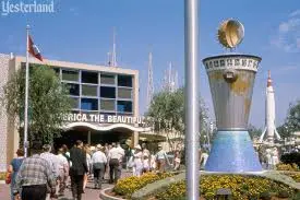 Historic photo of Disneyland’s original Tomorrowland in the 1950s featuring the America the Beautiful attraction, classic Tomorrowland pylon, and early park guests—capturing Walt Disney’s opening-year Tomorrowland design.